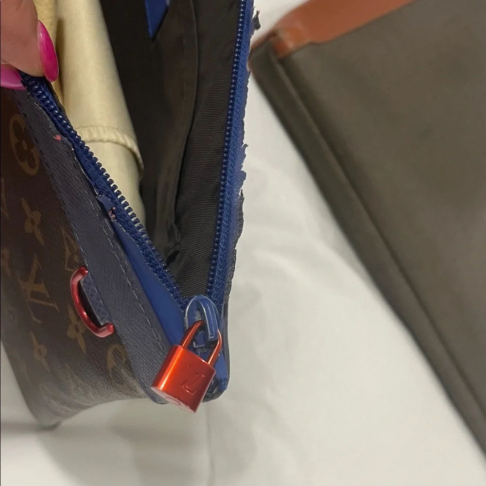 Louis Vuitton Monogram Brown and Blue Toiletry Bag
Women’s Clutch - Picture 3 of 6